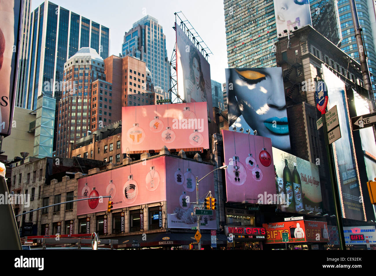 New York City Time Square buildings with huge billboards adverts for  Maybelline and Tous jewelery Stock Photo - Alamy