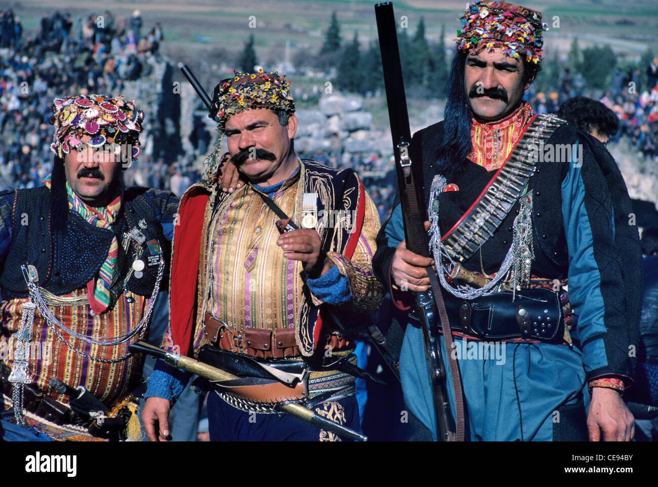 Three Turks, known as Zeybek, in Traditional Turkish Aegean Military or Folkloric Costume, Camel Wrestling Festival, Ephesus Selcuk Turkey Stock Photo