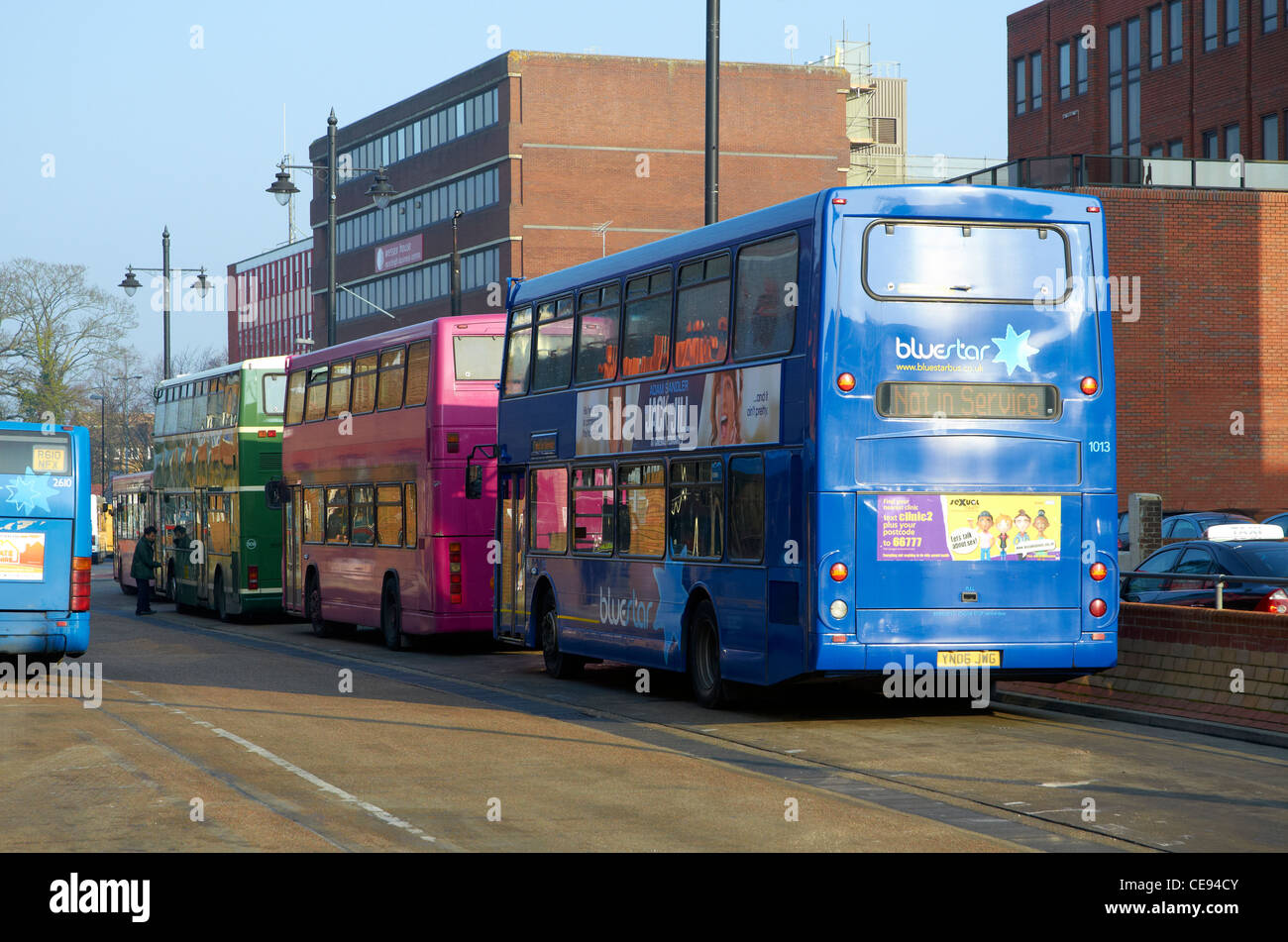 Bus station in Eastleigh, Hampshire, England with vehicles from three different bus companies. Stock Photo