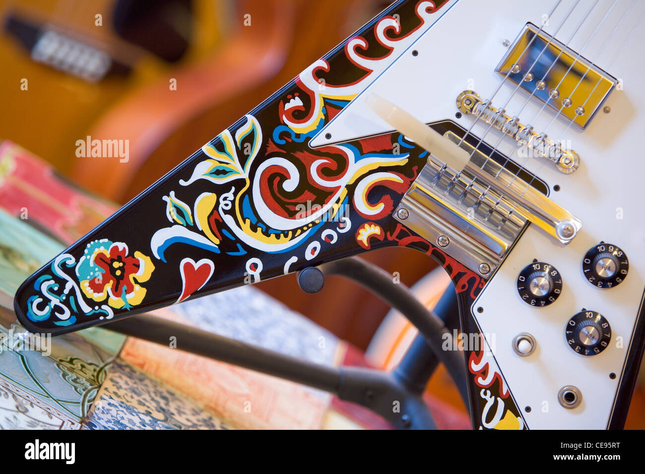 A 1967 Gibson Flying V guitar which was owned and painted by Jimi Hendrix. The paintwork was restored in 1999. Stock Photo