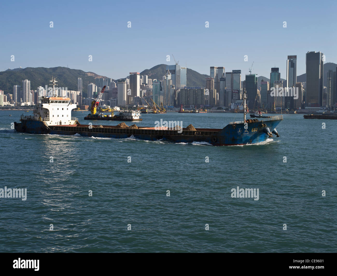 dh  HONG KONG HARBOUR HONG KONG Bulk cargo ship earth for reclaiming land Victoria harbour Stock Photo