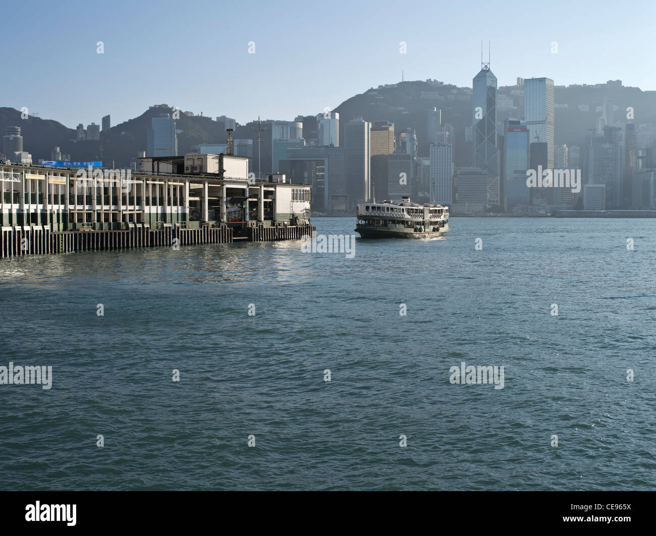 dh star ferry pier TSIM SHA TSUI HONG KONG star ferry kowloon pier waterfront hong kong harbour skyline Stock Photo