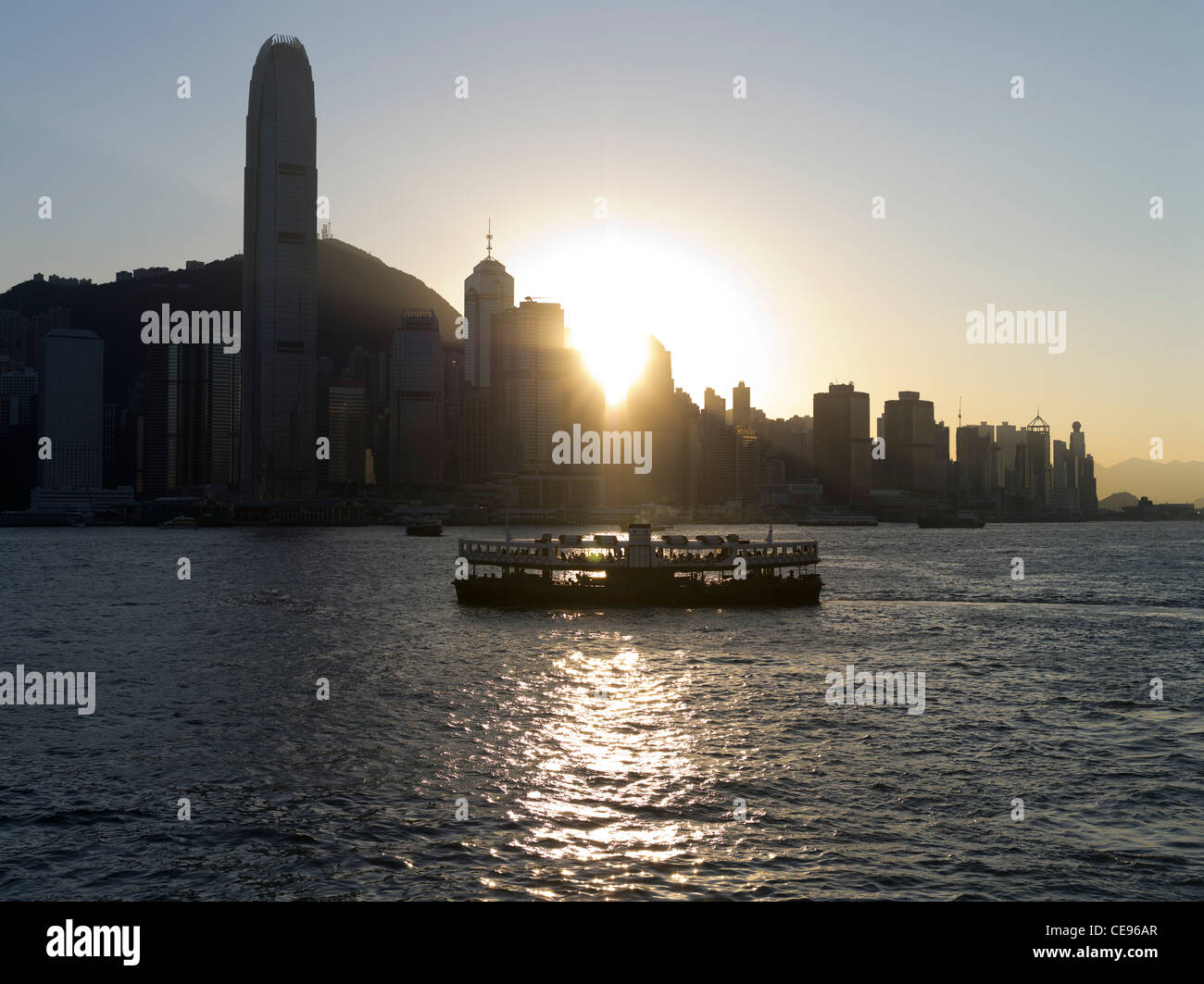 dh  HONG KONG HARBOUR HONG KONG Star Ferry Hong Kong island sunset waterfront buildings IFC2 tower skyline Stock Photo