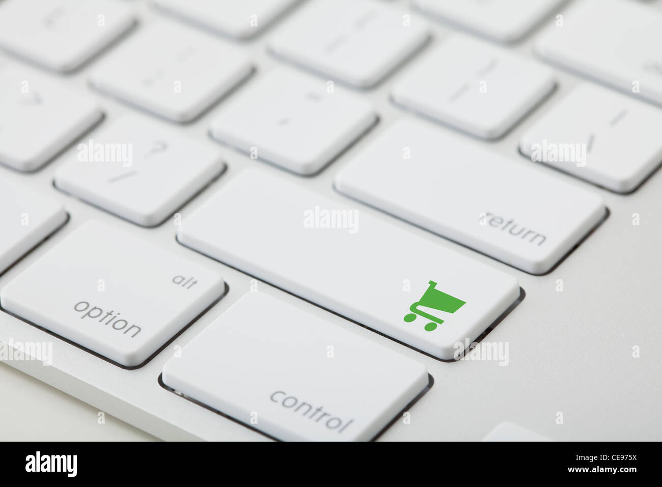 Computer keyboard with shopping cart icon on key Stock Photo
