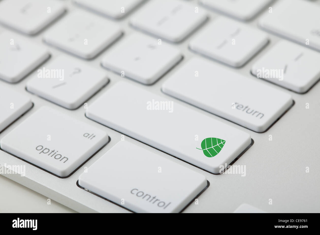 Computer keyboard with leaf icon on key Stock Photo