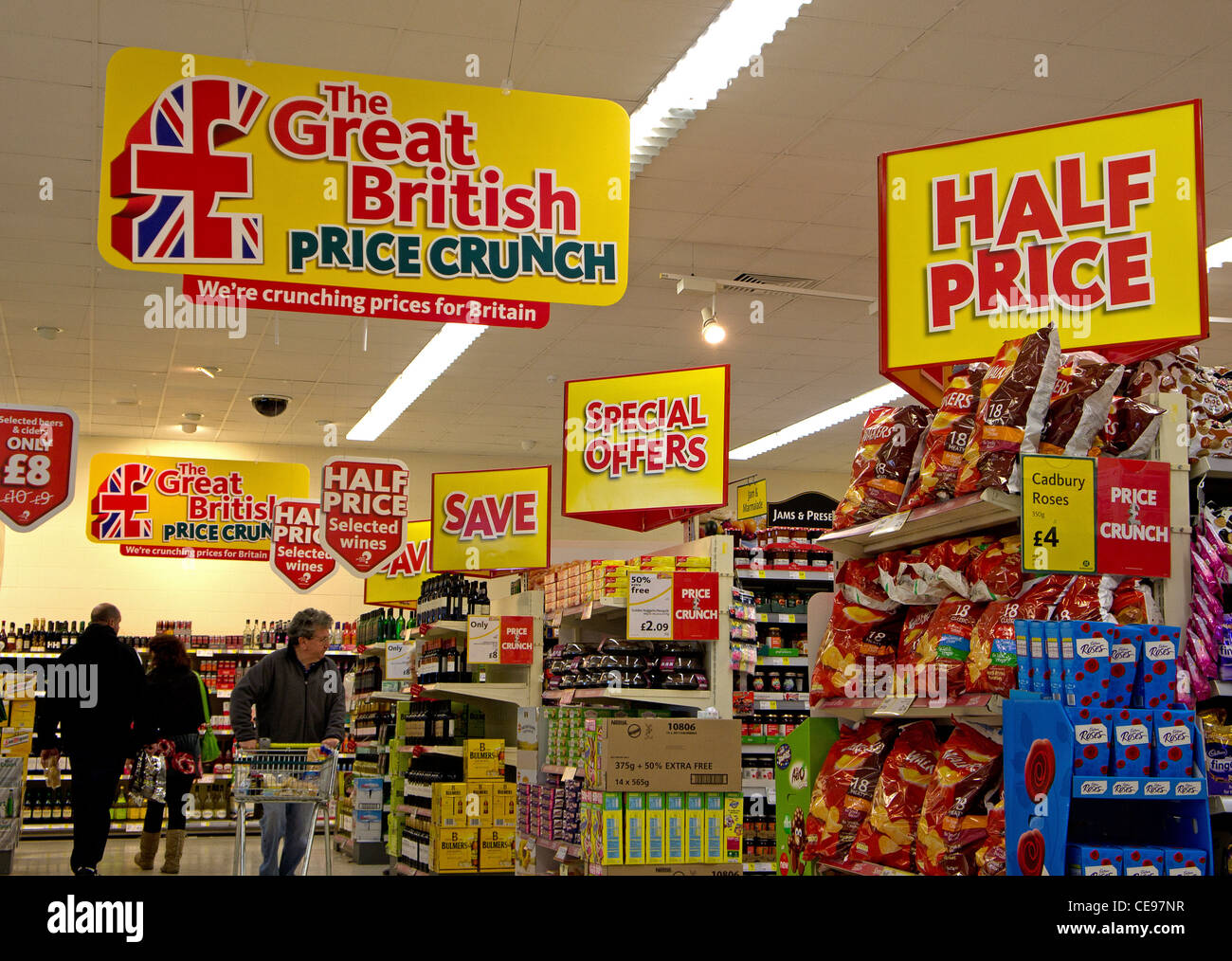 Half price and special offer posters in a Morrisons supermarket, UK Stock Photo