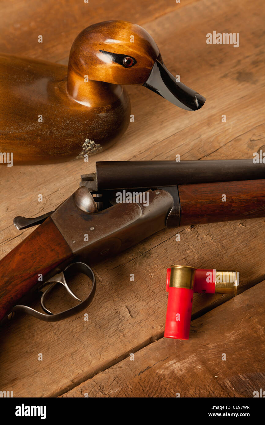 USA, Illinois, Metamora, Wooden duck, gun and bullets on table Stock Photo