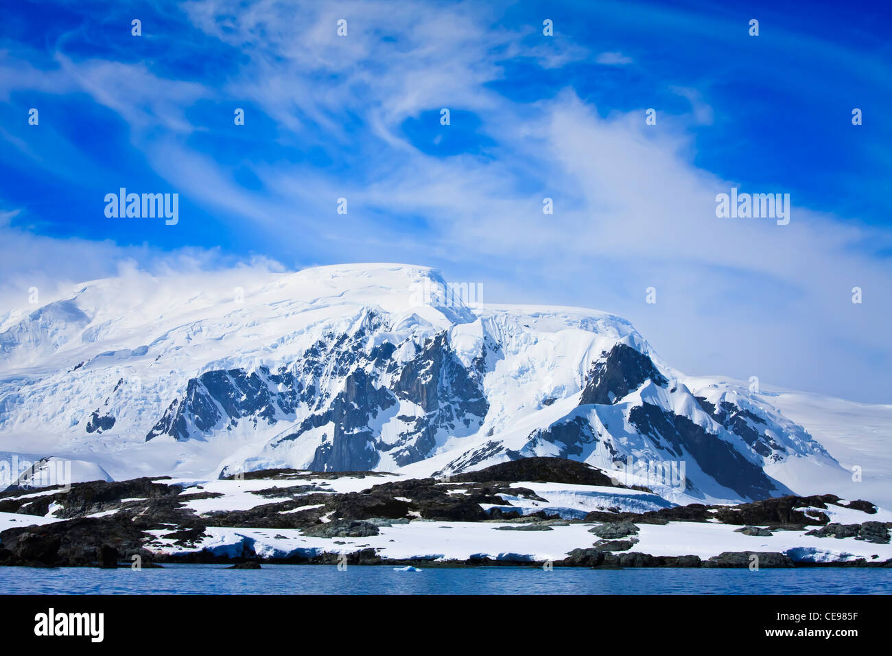 Beautiful snow-capped mountains against the blue sky Stock Photo - Alamy