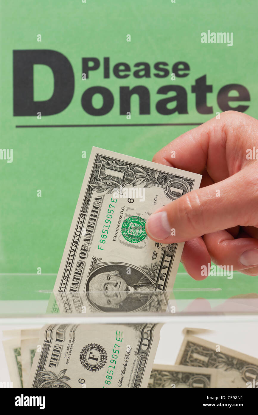 USA, Illinois, Metamora, Man's hand giving donation Stock Photo