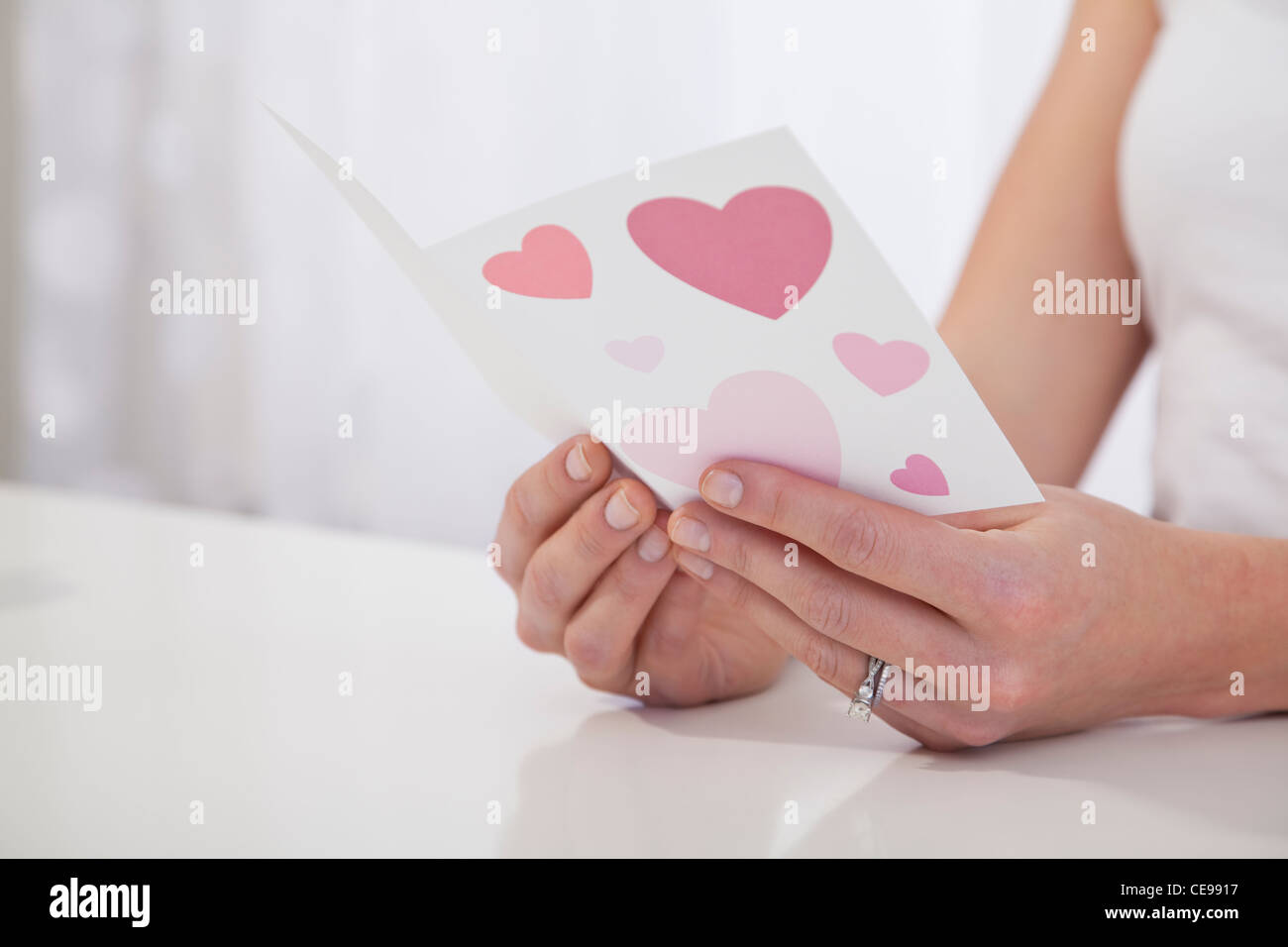 USA, Illinois, Metamora, Close-up of woman's hands holding Valentine's card Stock Photo