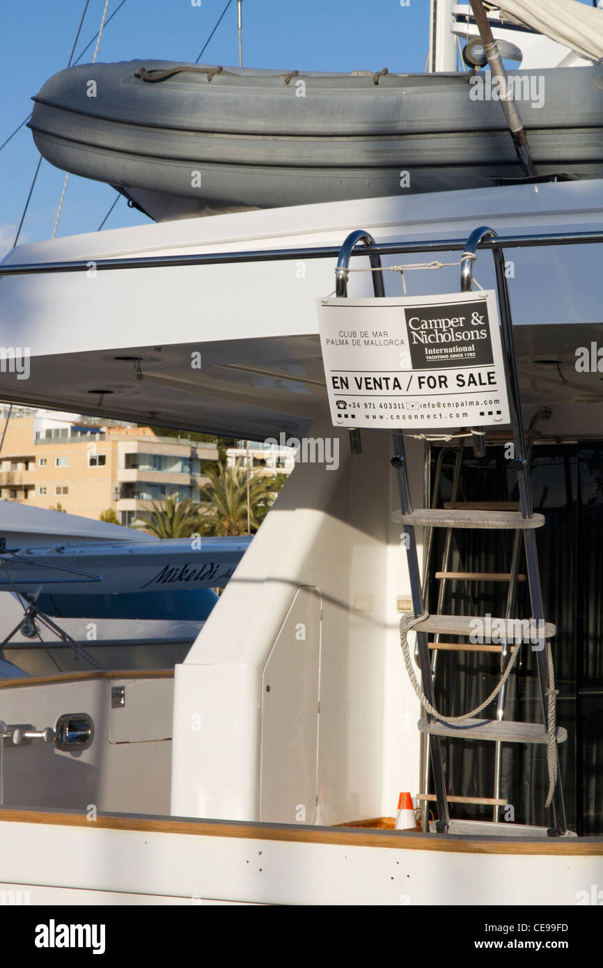 Back of luxury motor boats yacht  for sale sign moored in Portals port Majorca Mallorca Balearic isles Spain Stock Photo