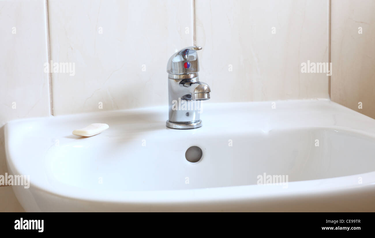 Bathroom interior with white sink and faucet - mixer tap Stock Photo - Alamy