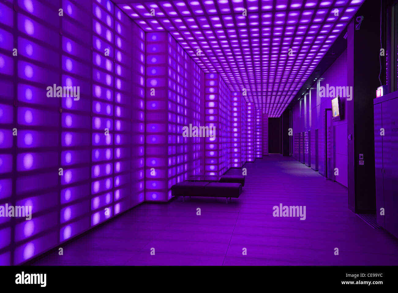 Purple coloured lights front of house entrancce to club room wall light  lobby lighting Stock Photo - Alamy