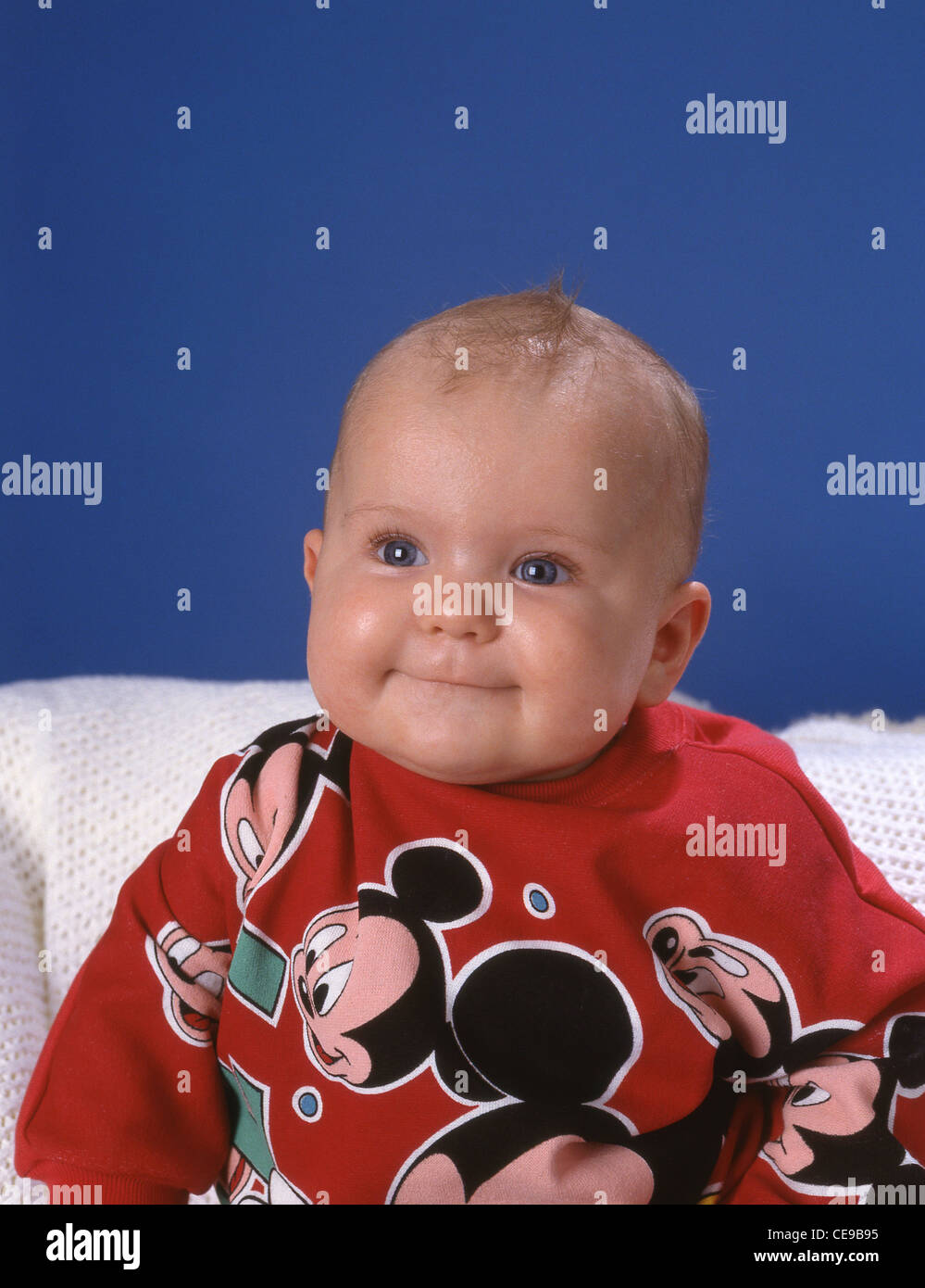 Young baby boy smiling in photo shoot, Berkshire, England, United