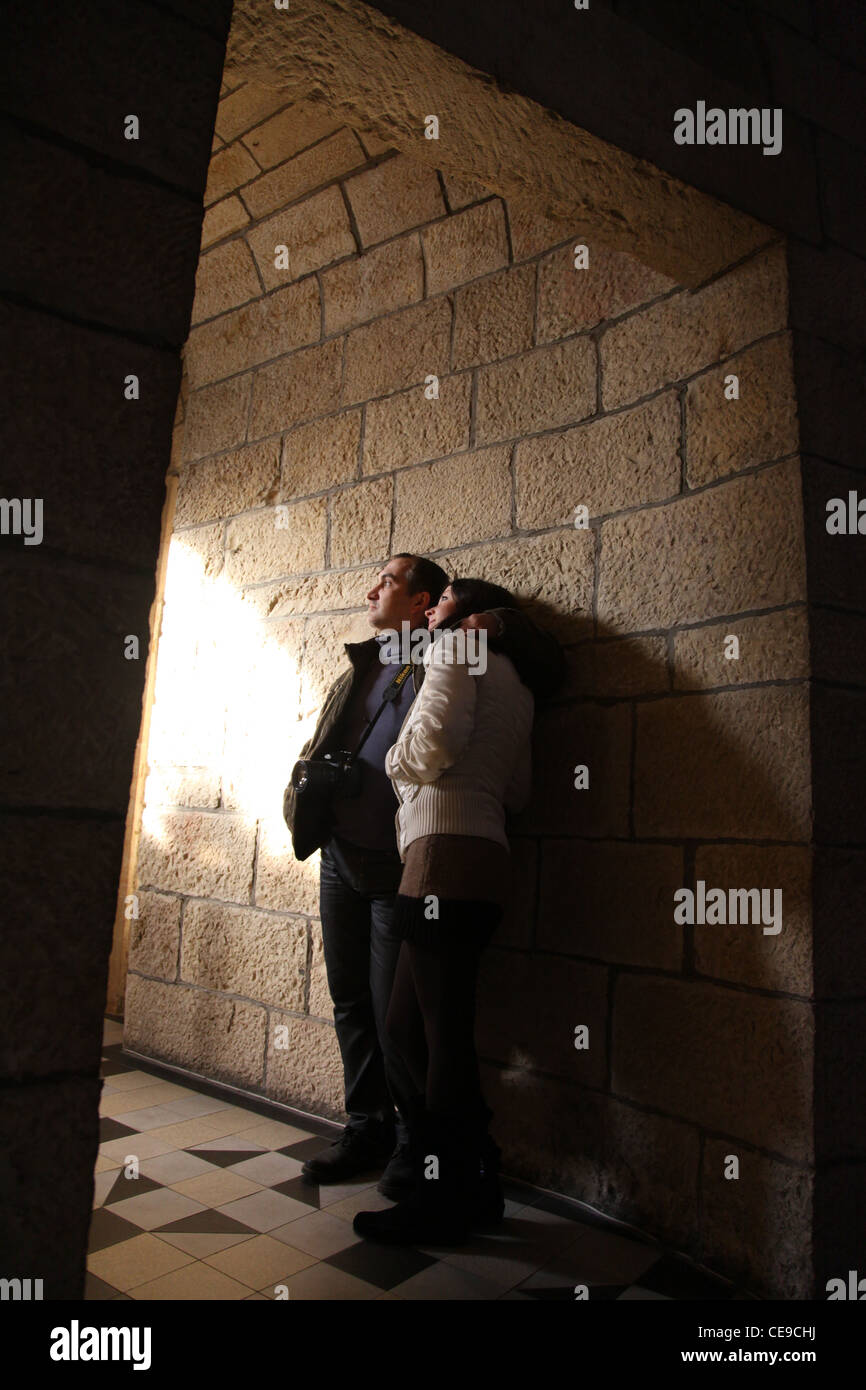 lovers alone in the Stone space of an old castle in the rays of light Stock Photo