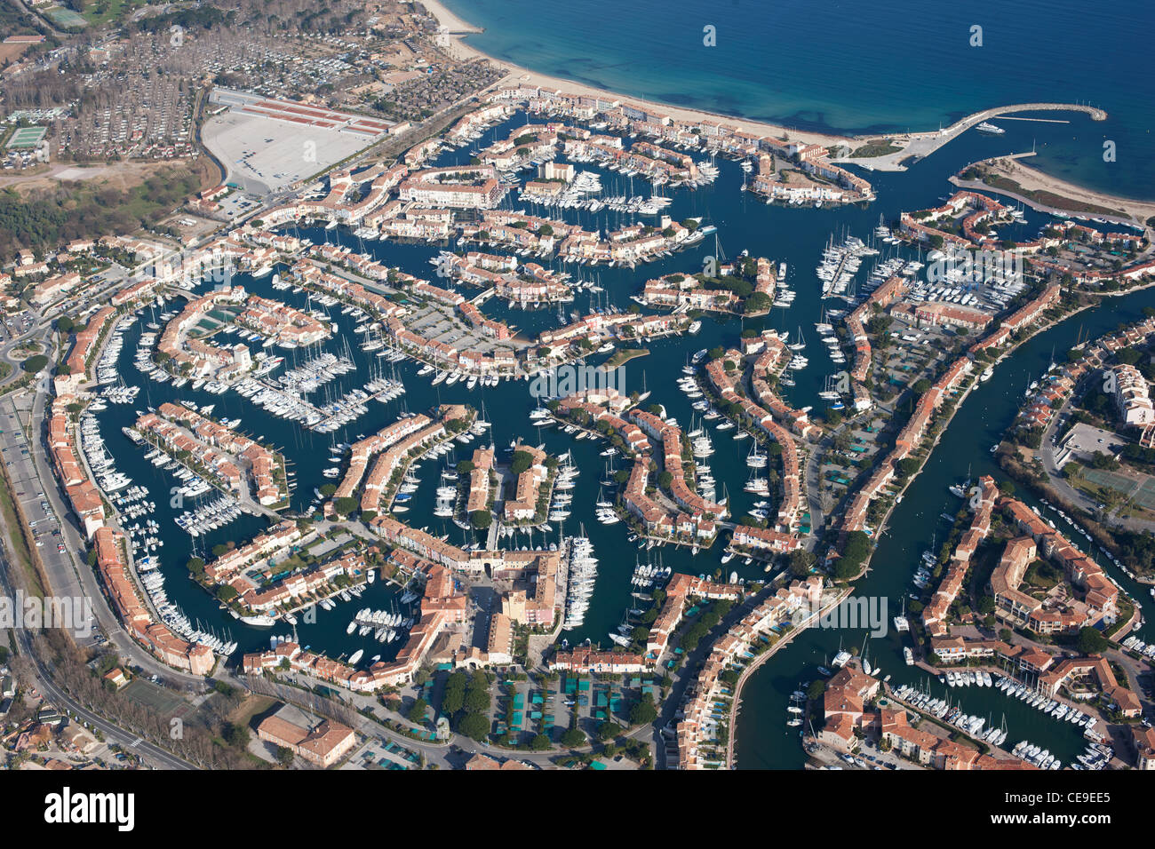 AERIAL VIEW. The seaside town of Port Grimaud, created in the 60s on a marshy land. Gulf of Saint-Tropez, Var, French Riviera, France. Stock Photo