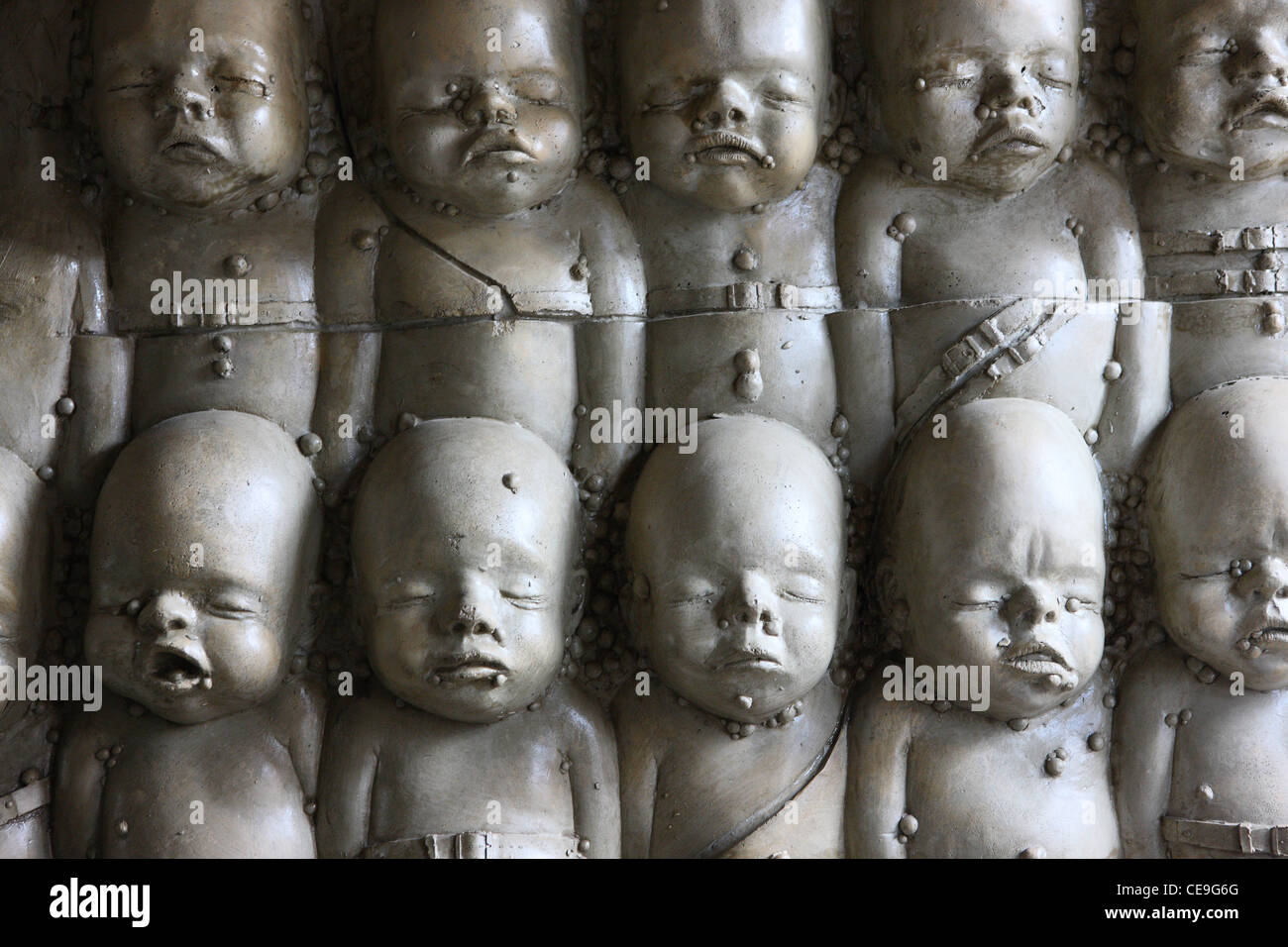 Faces of children in 'Alien Cafe' by H.R. Giger in Gruyères, Switzerland. Stock Photo