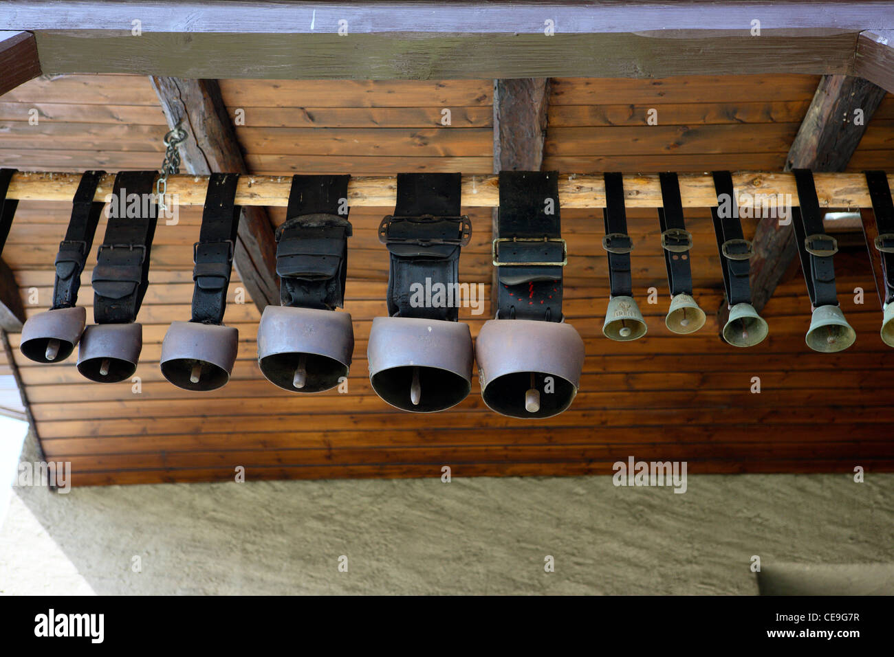 Cowbells hang in the barn Stock Photo Alamy