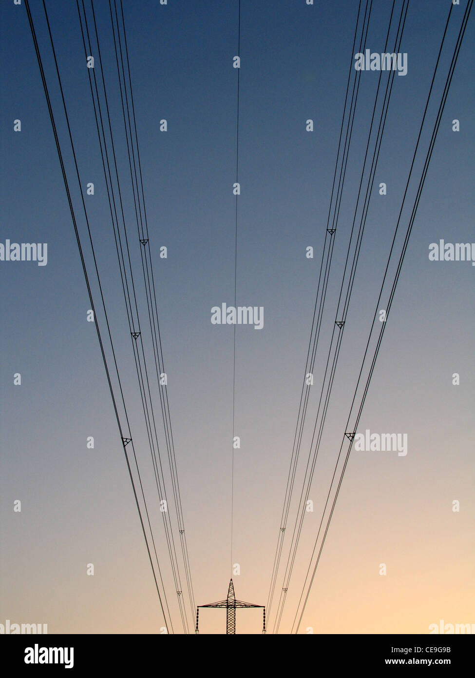 High voltage power transmission lines and electrical pylon Stock Photo ...