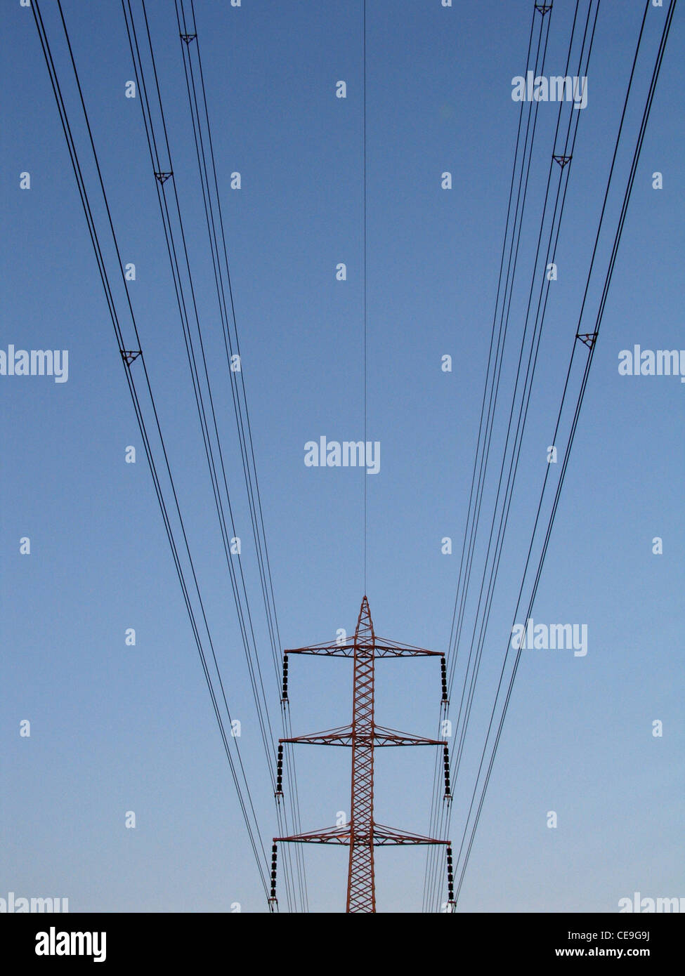 High voltage power transmission lines and electrical pylon Stock Photo
