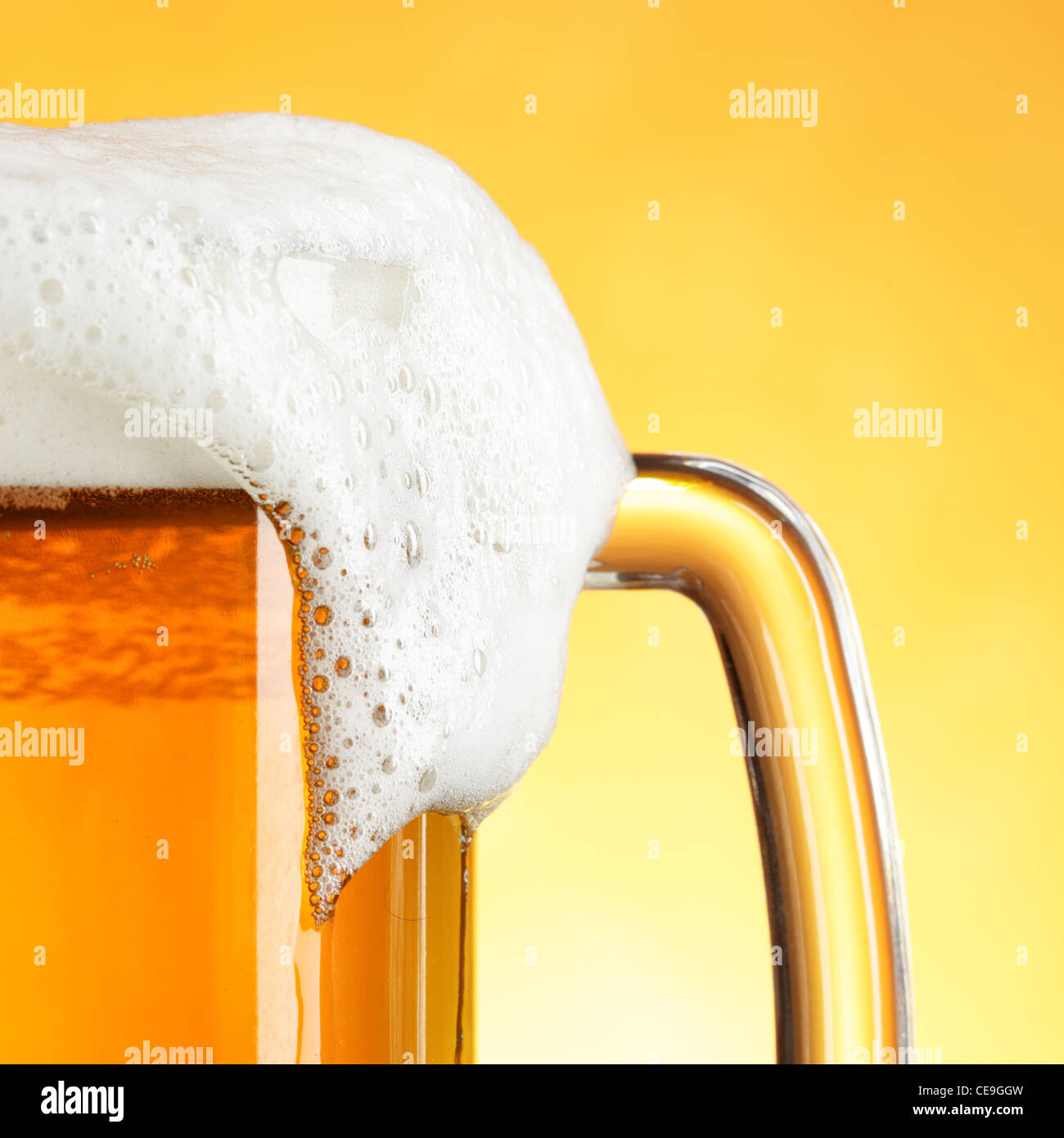 Download Beer Mug With Froth Over Yellow Background Stock Photo Alamy Yellowimages Mockups