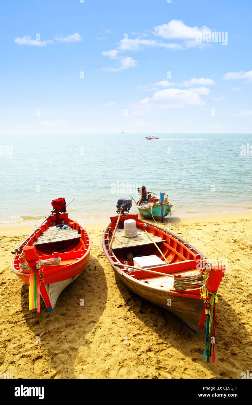 Three fshing boats close-up at sandy beach Stock Photo
