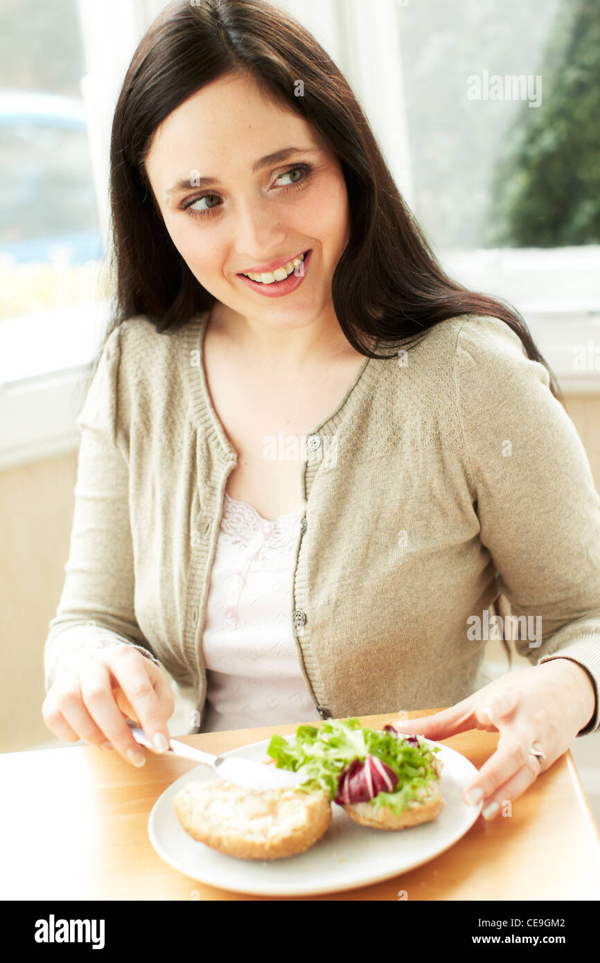 Woman eating healthy sandwich Stock Photo