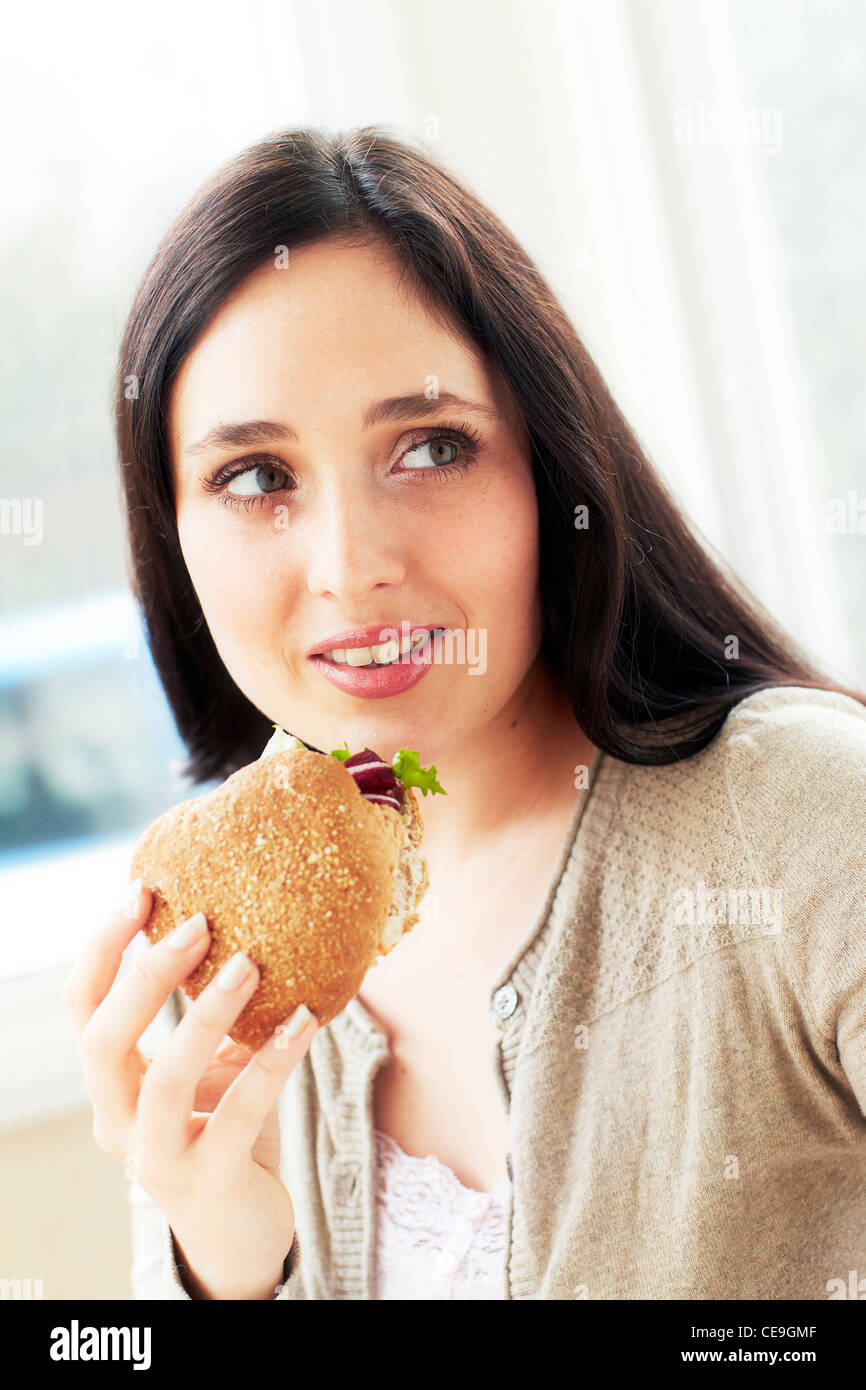 Woman eating healthy sandwich Stock Photo