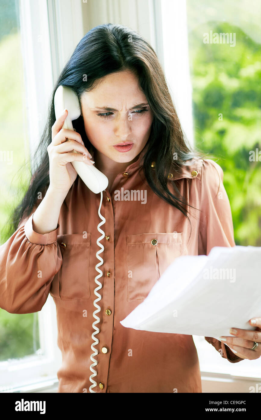Woman complaining on the phone Stock Photo