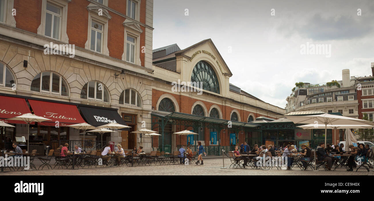 People eating outside the cafes in Covent Garden, London, England. Stock Photo