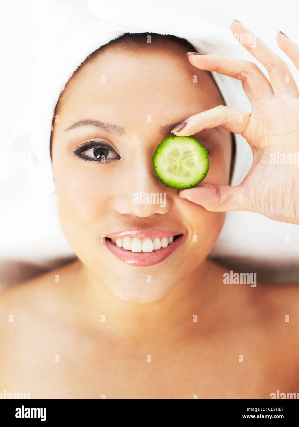 Woman with cucumber over her eyes Stock Photo