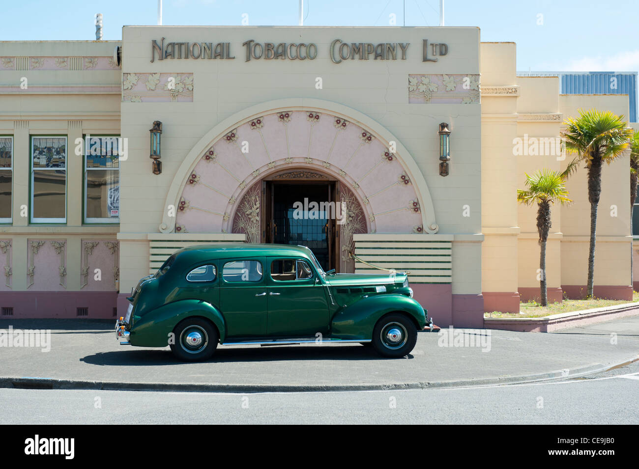 Art deco Napier. A classic car is parked in front of the Art Deco style National Tobacco Company building. Stock Photo