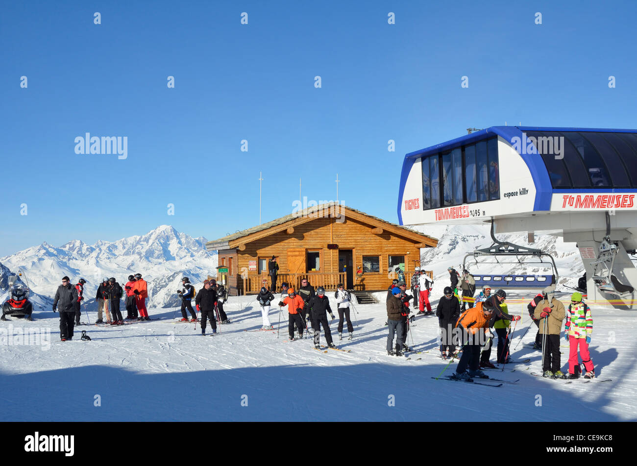 Skiers leaving the Tommeuses Chair Lift, Tignes, Vanoise, Alps, Savoire, France Stock Photo