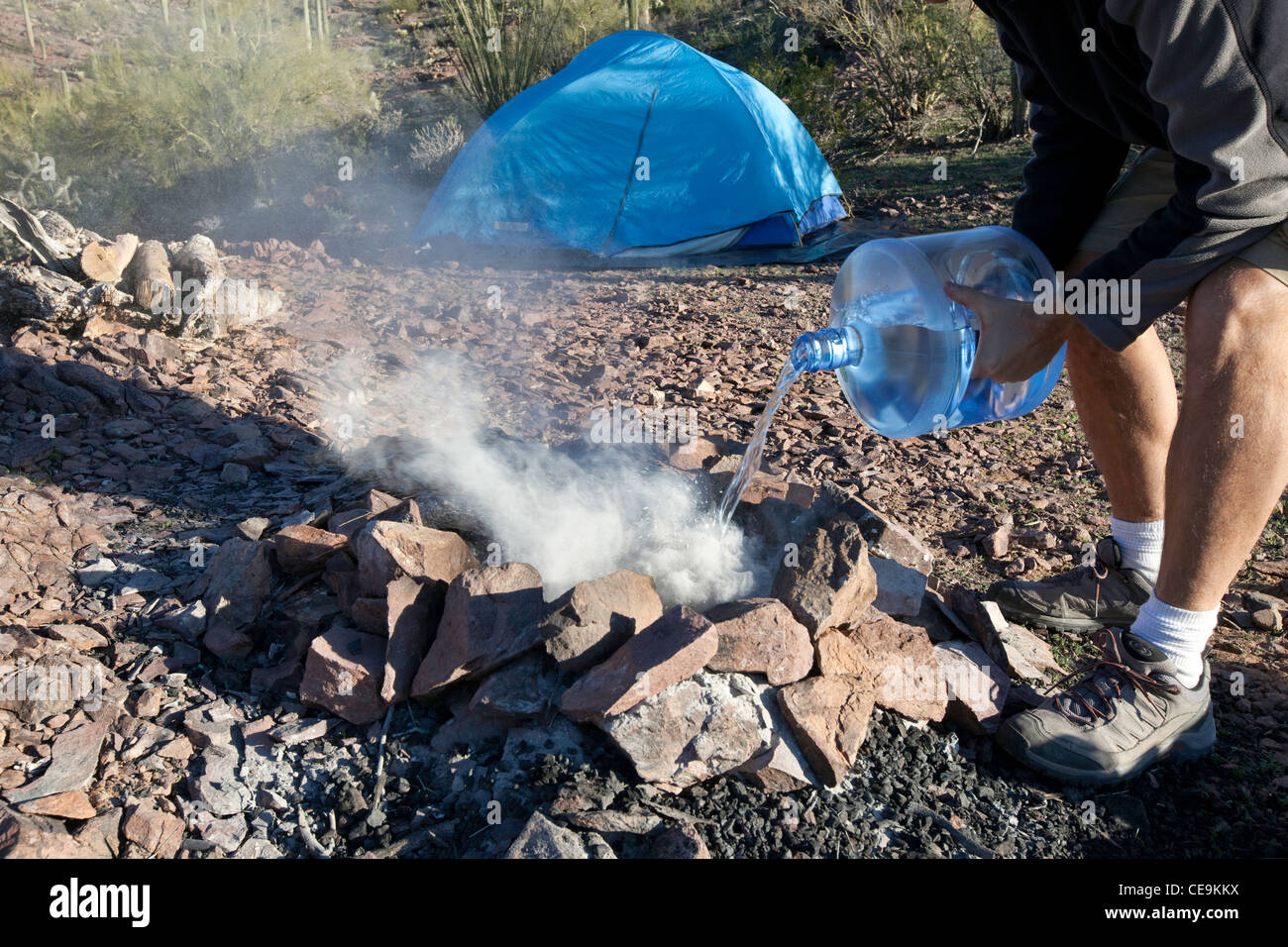 Drowning the camp fire Stock Photo