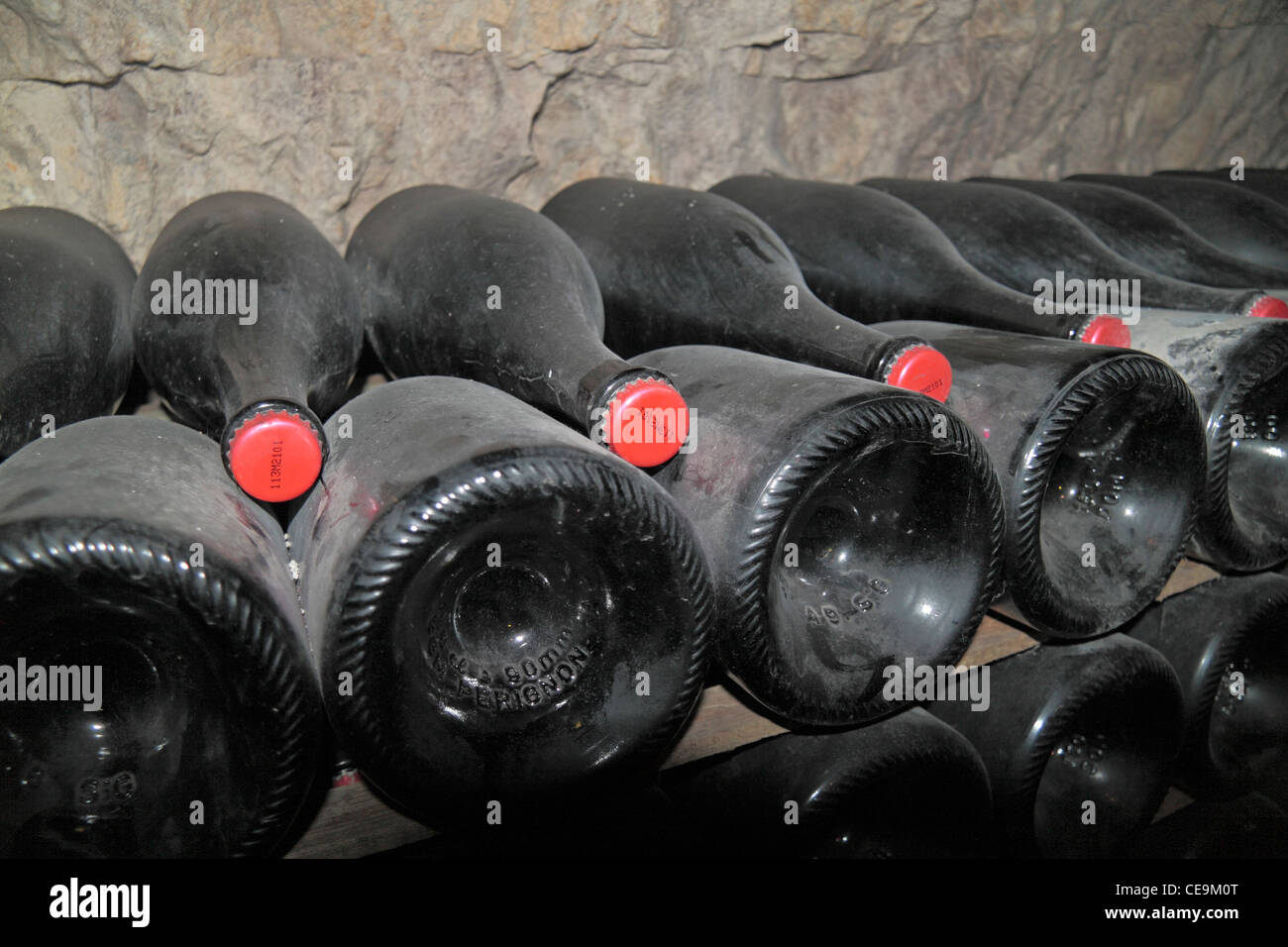 Stacks of champagne bottles maturing (with red crown caps) the Moet et Chandon Champagne Cellars