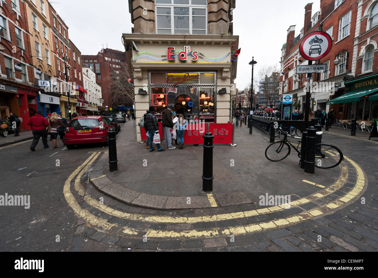 Eds diner Old Crompton Street Soho London. Wide angle voew showing street furniture and yellow lines Stock Photo