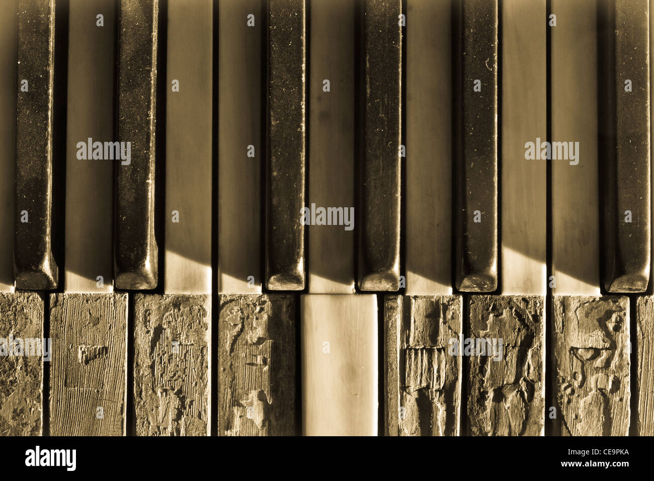 Closeup broken piano keys in sepia toned Stock Photo Alamy