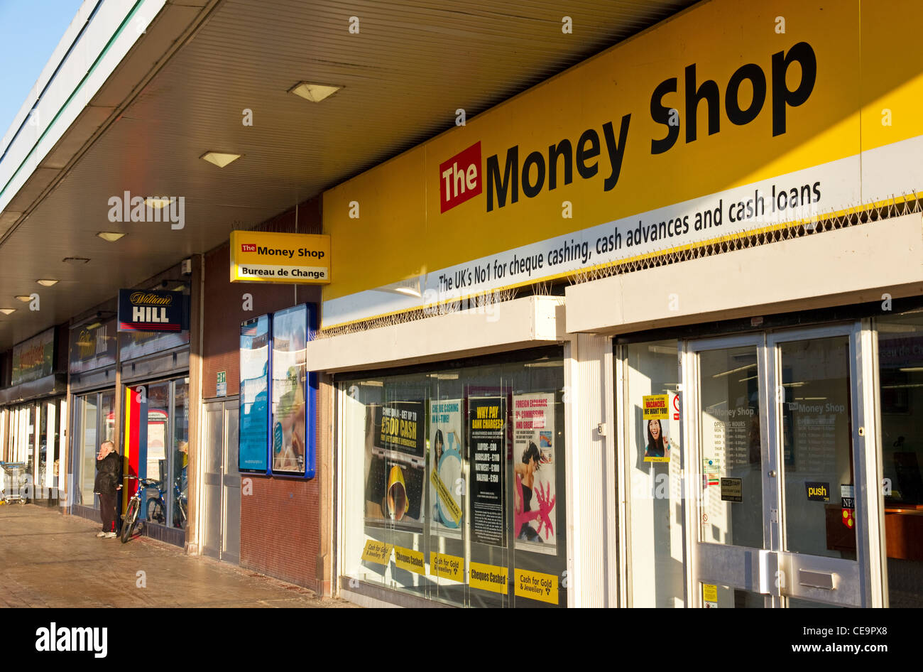 Bookmakers next door to money lending shop, Salford Shopping Centre, Pendleton, Salford, Greater Manchester, UK Stock Photo