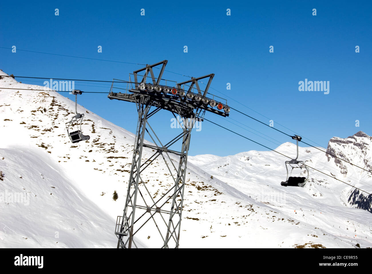 A stanchion supporting the pulley mechanism for a chairlift in a Swiss ski resort Stock Photo