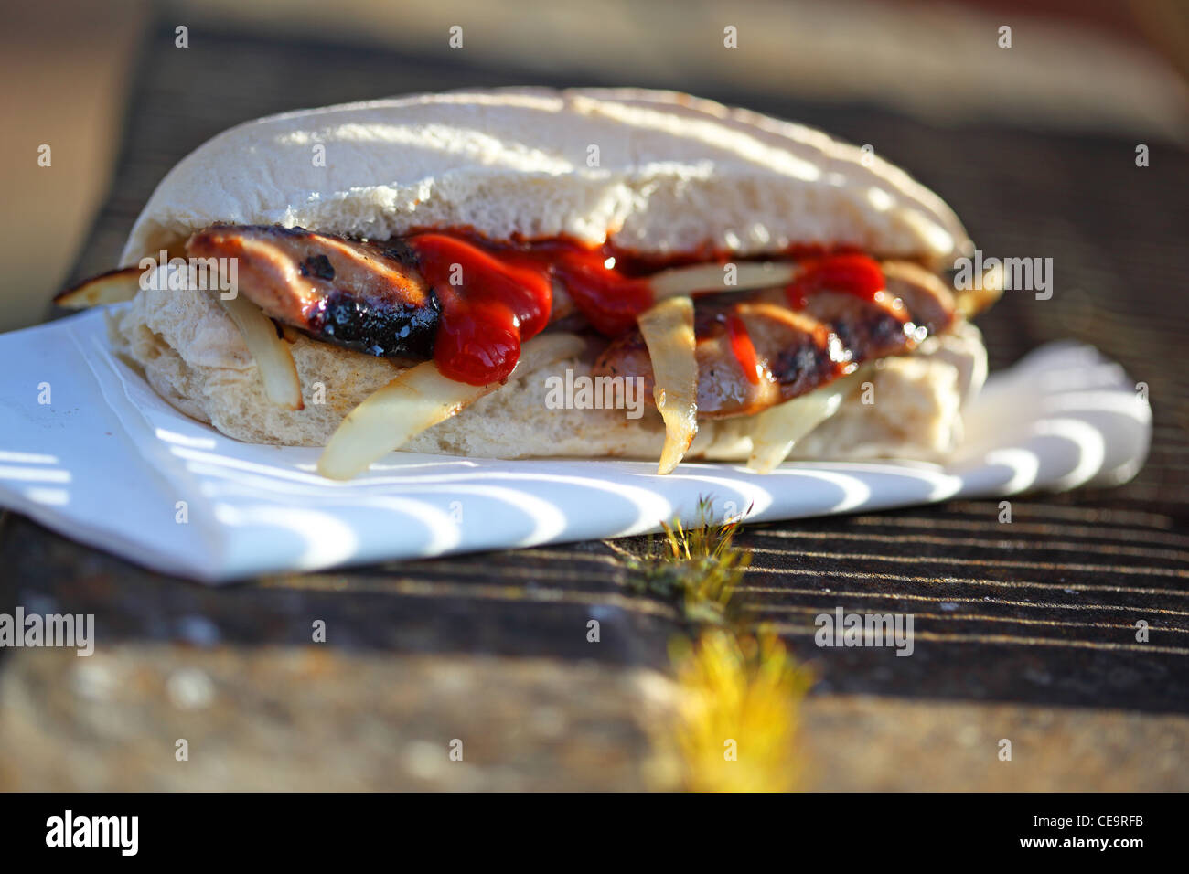 sandwich sausage barm eating on the street Stock Photo