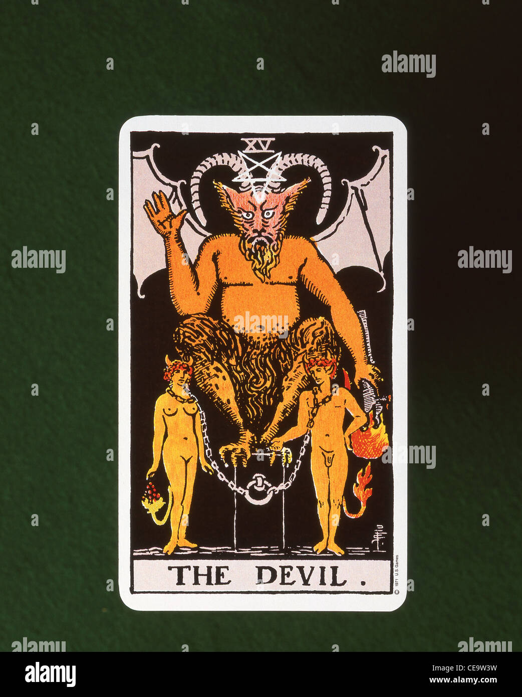 The Devil (XV) fifteenth Tarot trump card on felt card table, England, United Kingdom Stock Photo