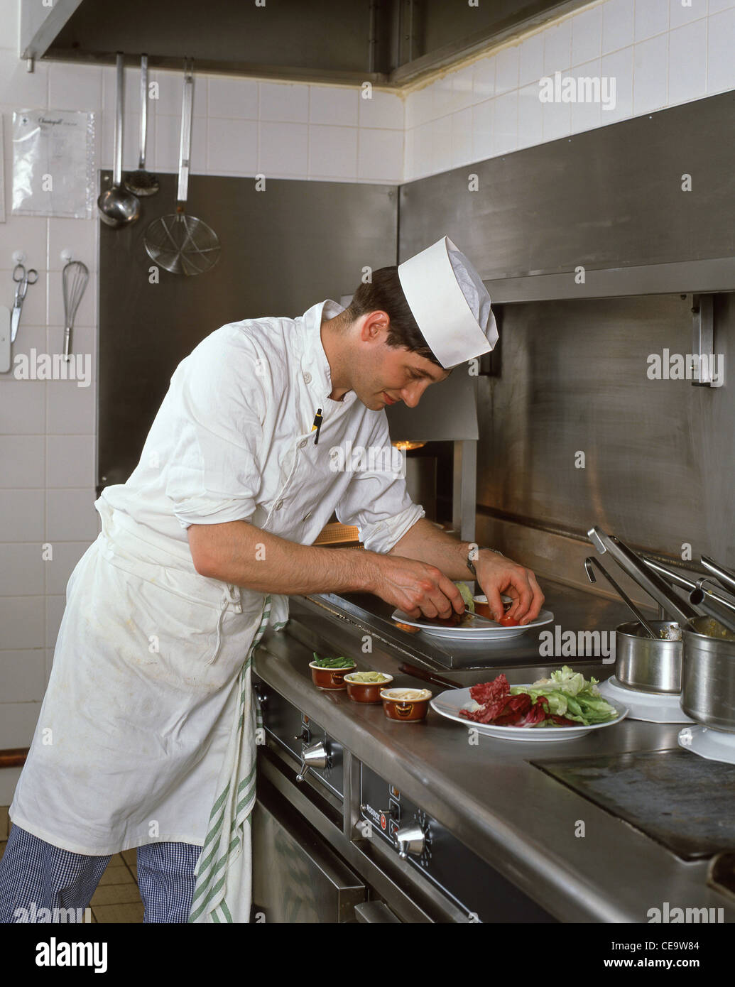 Chef preparing food in kitchen, London, England, United Kingdom Stock Photo