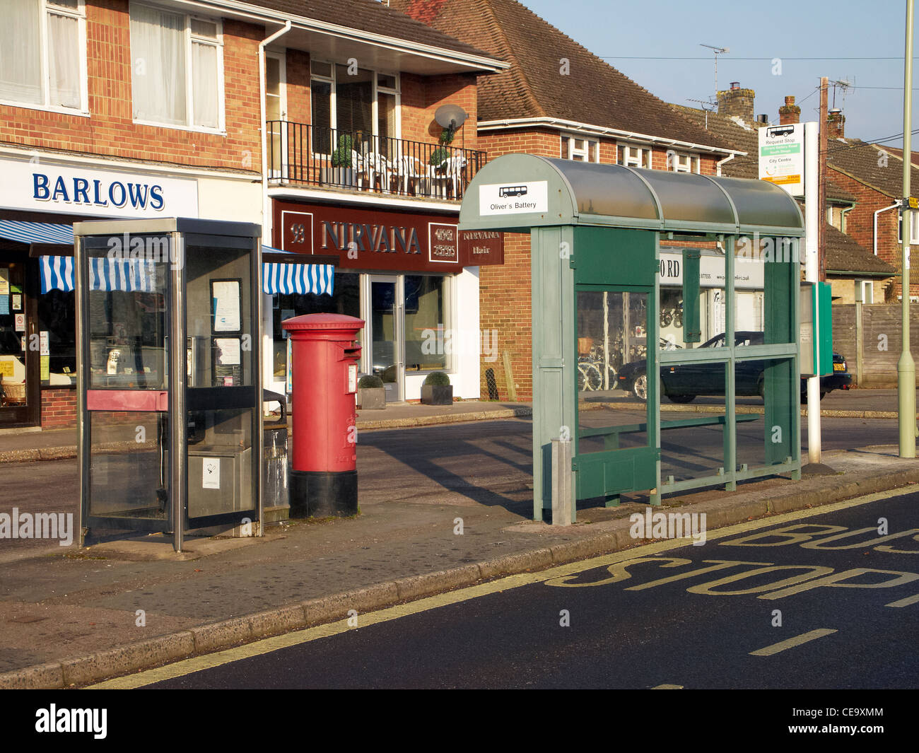 Parade of local shops with phone box, post box and bus shelter, in Olivers Battery a suburb of Winchester, Hampshire,. England Stock Photo