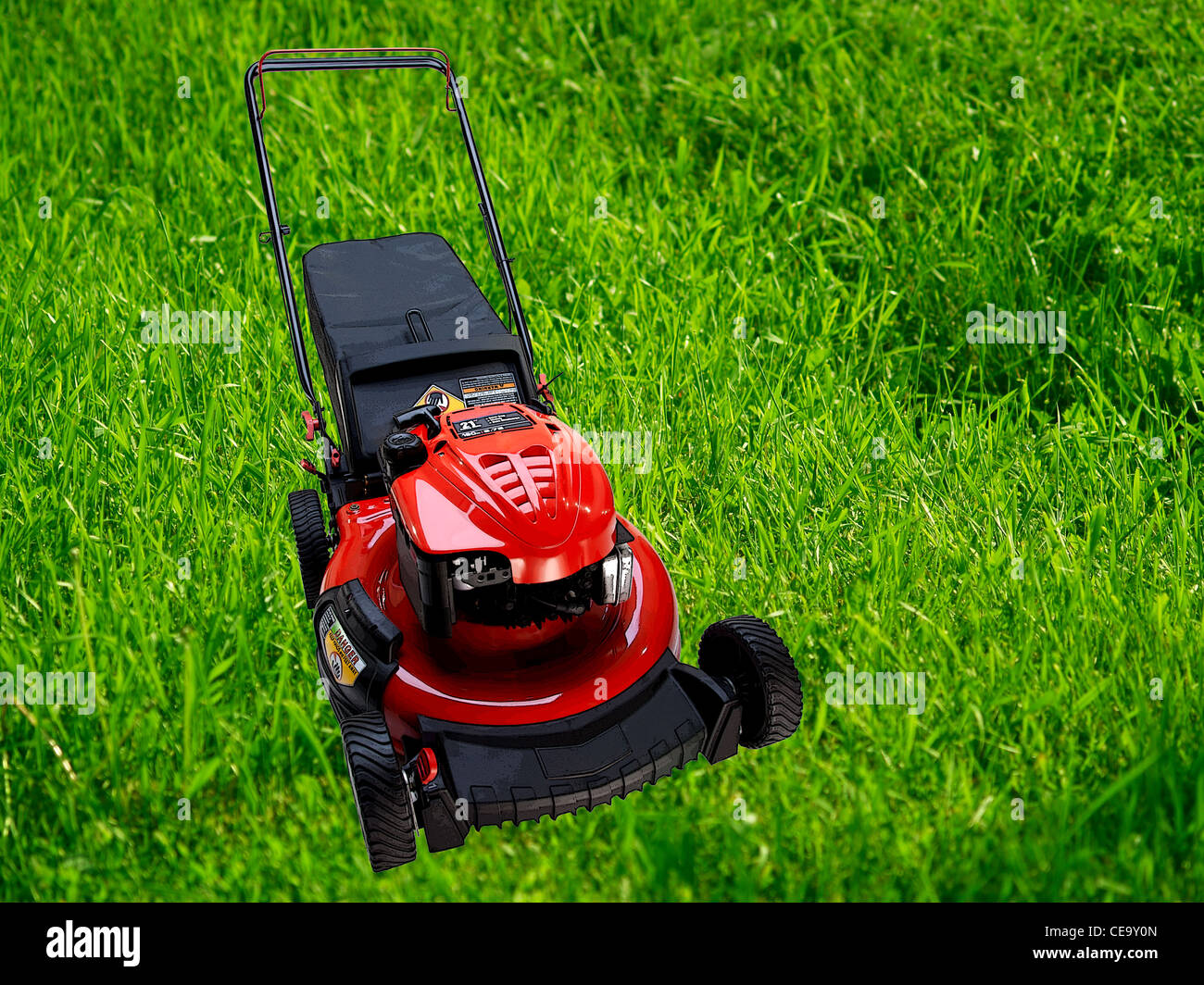 Lawn mower on big grass background Stock Photo