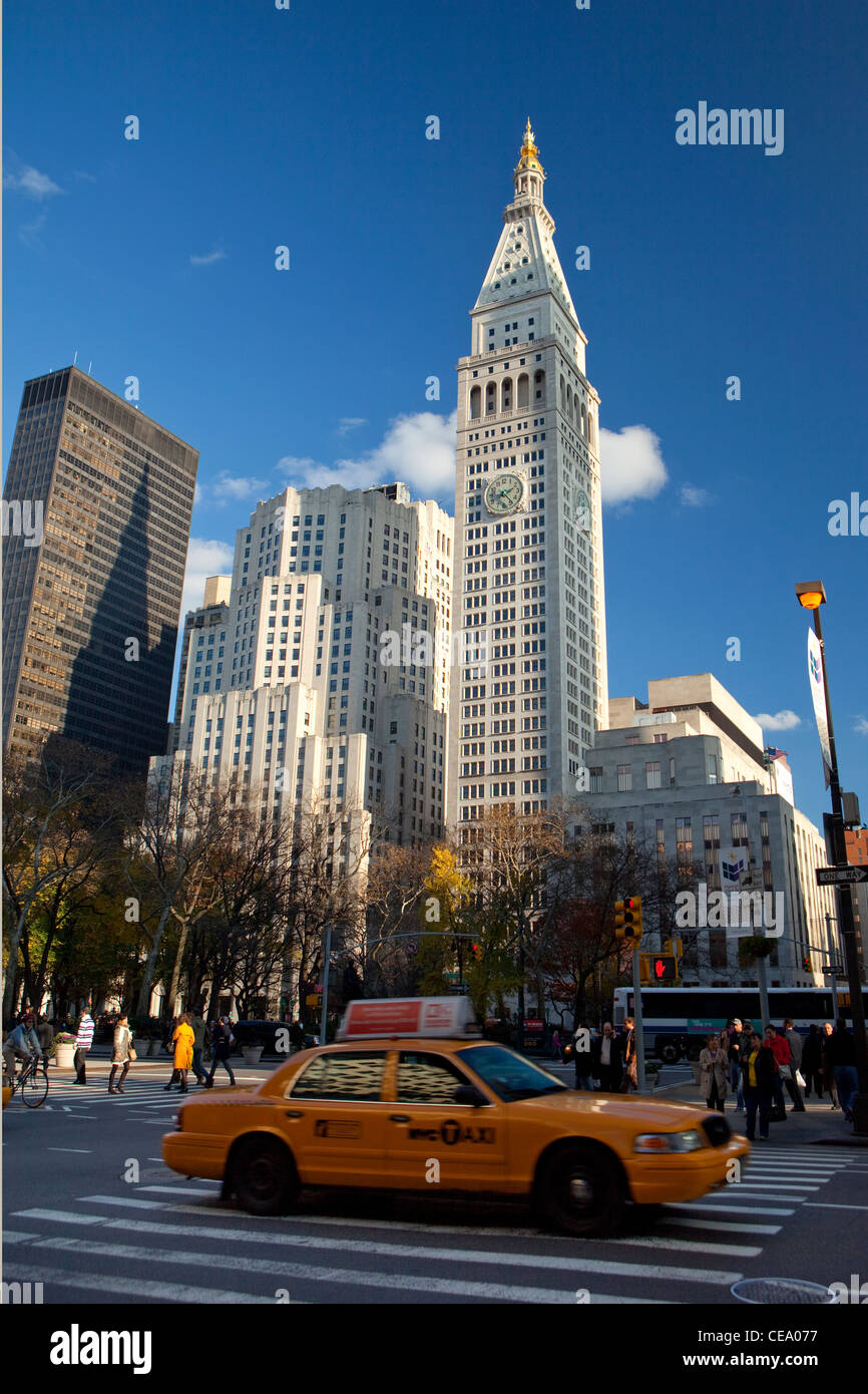 Traditional NYC Yellow taxi, Metropolitan Life tower Madison Square park in the background, USA Stock Photo