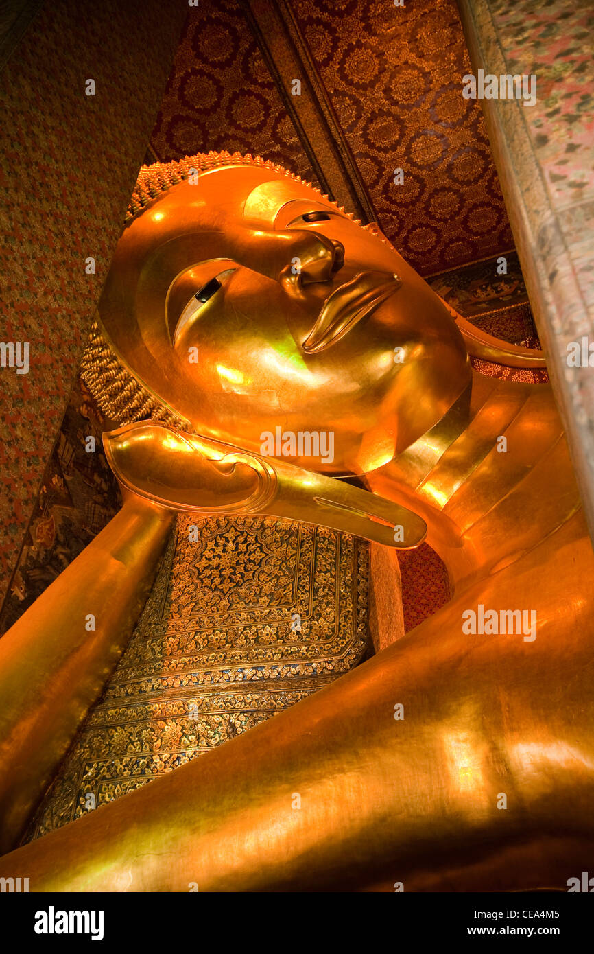 Giant Golden Reclining Buddha, Wat Po Temple, Phra Nakhon district, Bangkok, Thailand. Stock Photo