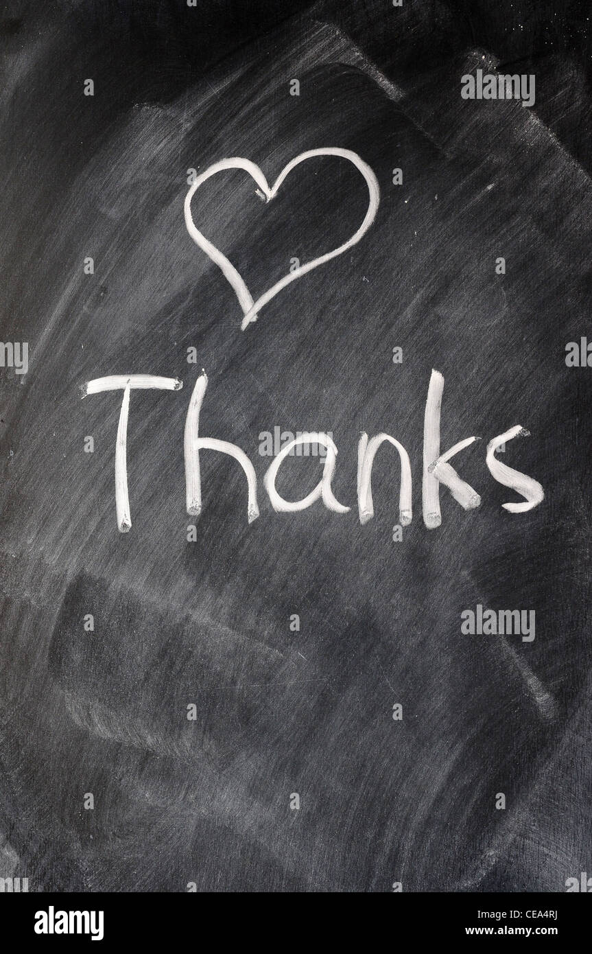 Handwriting of Thank you on a blackboard Stock Photo