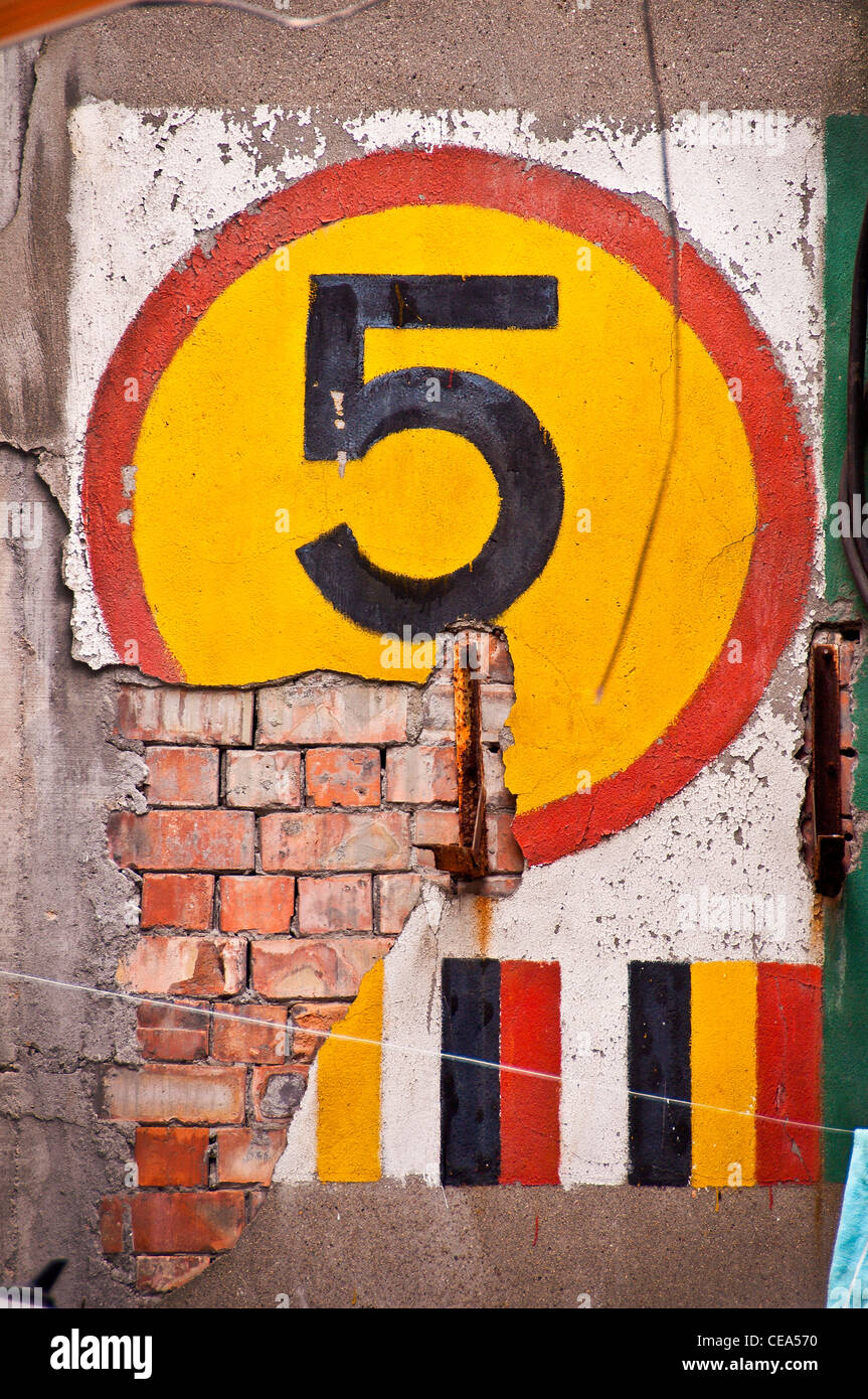 Number 5 on a brick wall - French Concession, Shanghai - China Stock Photo