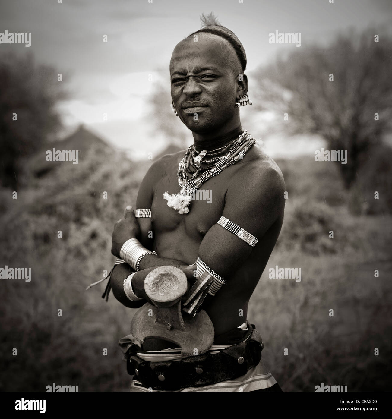 Portrait Of Bashada Man With Jewels And Headrest Omo Valley Ethiopia Stock Photo