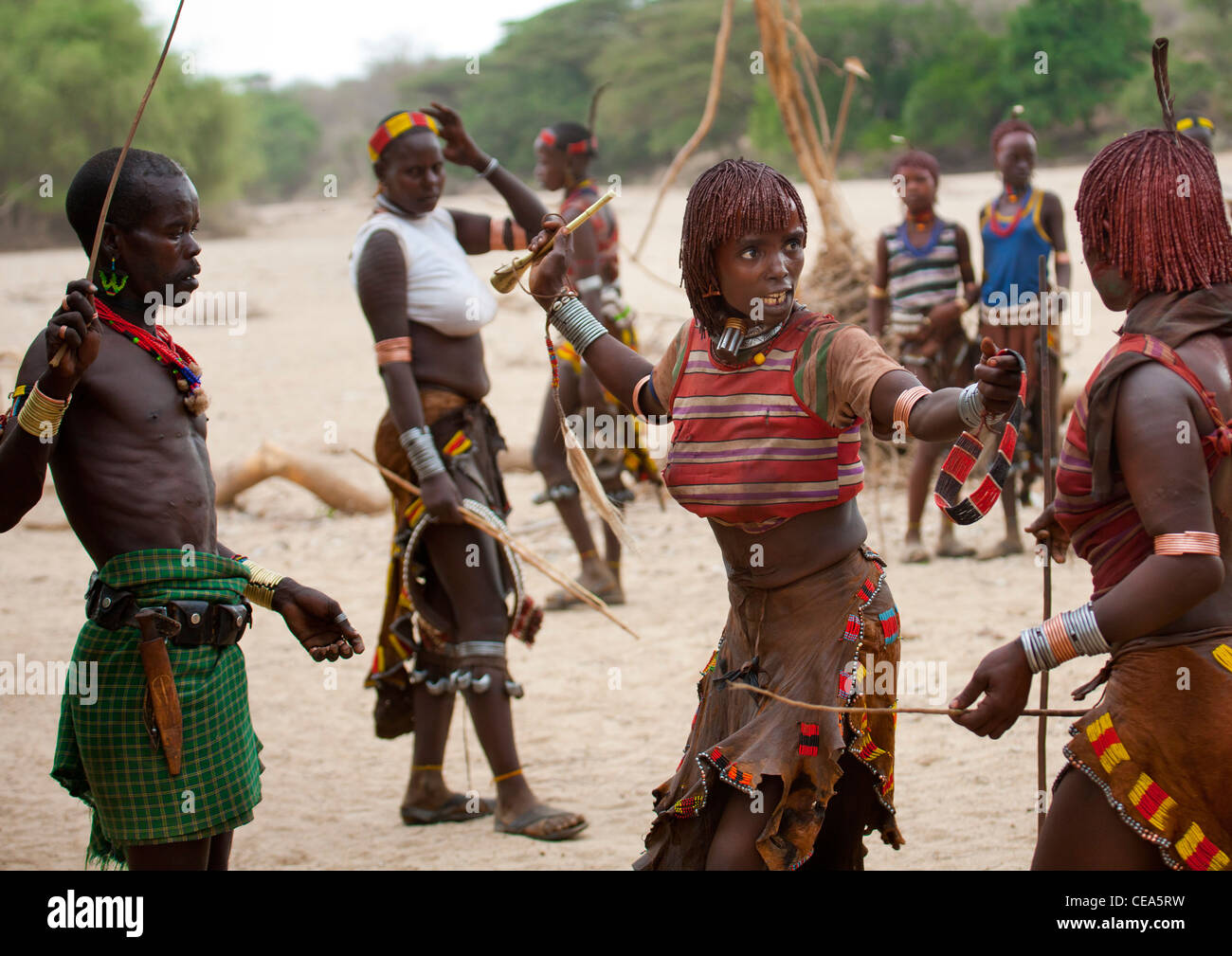 Hamer Woman Getting Flogged By The Whipper During Celebration Of Bull Jumping Ceremony Ethiopia Stock Photo